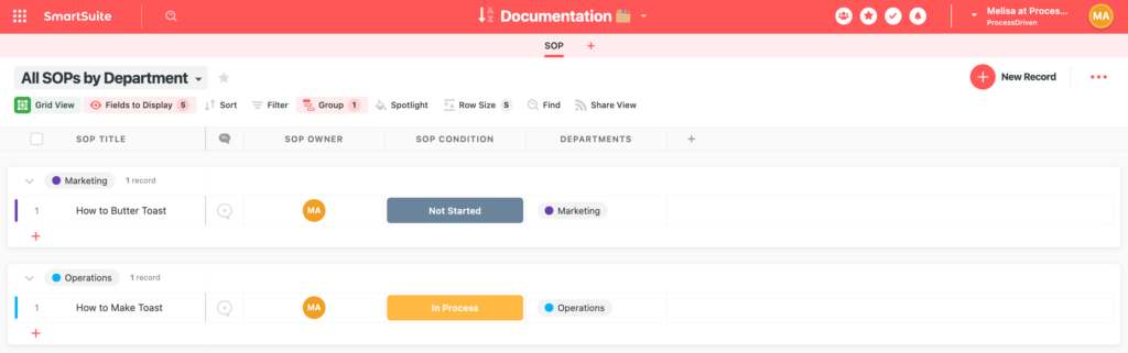 Example of grouping by Department in a SmartSuite App.